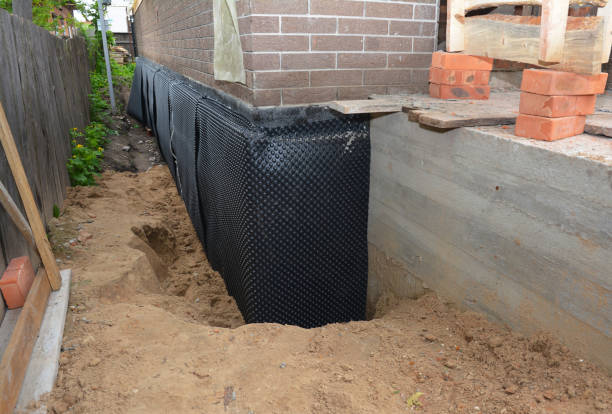 Happy homeowners after waterproofing job in Cherry Hill
